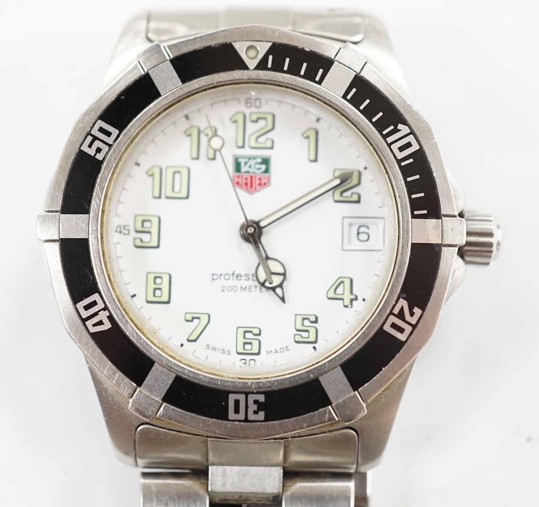 A gentleman's recent stainless steel Tag Heuer Professional quartz wrist watch, no box or papers. Condition - poor to fair